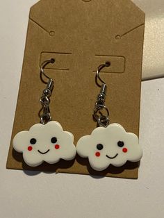 Happy cloud dangling earrings. Cute White Dangle Earrings, Cute White Earrings For Everyday, Cute White Earrings For Everyday Wear, Playful White Nickel-free Earrings, Fun Everyday Dangle Earrings, White Fun Dangle Earrings, Cute Everyday Dangle Earrings, Playful White Earrings With Ear Wire, Fun White Earrings For Everyday