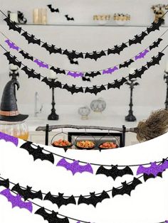 halloween decorations with bats hanging from the ceiling