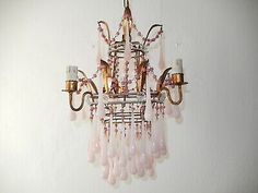 a pink chandelier hanging from the ceiling