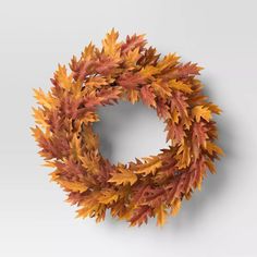 an orange and yellow wreath with leaves