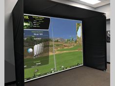 an interactive golf simulator is shown on the wall