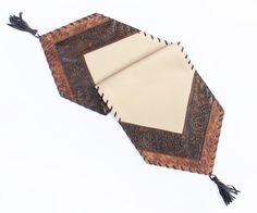 an umbrella shaped object with tassels on it