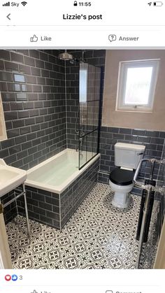 a bathroom with black and white tile on the floor, walls and floors is shown in an instagram