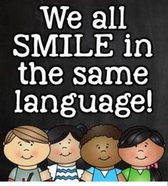 we all smile in the same language on a blackboard with text that reads, we all smile in the same language