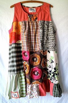 a colorful dress hanging on a wooden hanger