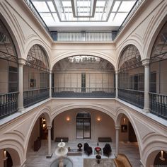 the interior of an old building with high ceilings