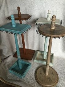 three wooden trays sitting on top of a white blanket next to each other,