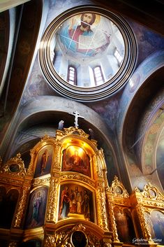 the inside of a church with paintings on the walls