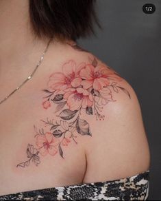 a woman's shoulder with flowers on it