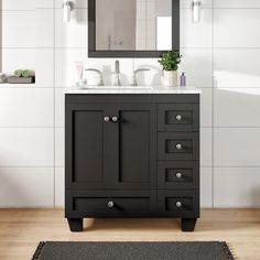 a bathroom vanity with two sinks and a mirror on the wall next to a rug