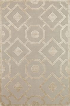 a beige rug with an abstract design on it