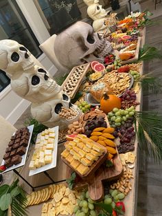 a long table filled with different types of snacks and desserts on top of it