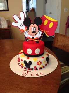 a mickey mouse cake on top of a table