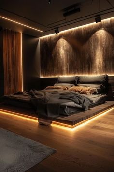 a large bed sitting in the middle of a room with lights on either side of it