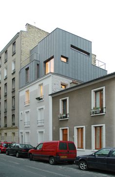 several cars parked on the side of an empty street