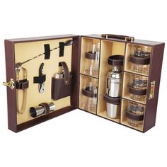 an open leather case with coffee and tea accessories in it, on a white background