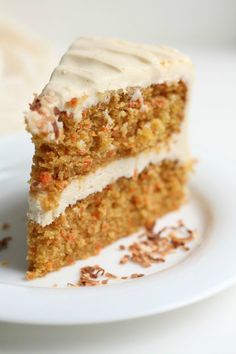 a piece of carrot cake on a white plate