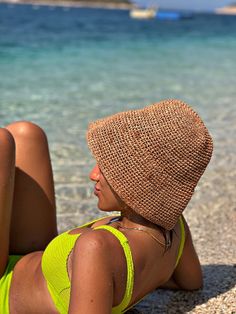 The summer hat is knitted with raffia yarn. does not sweat. The diameter of the top of the hat is 16 cm. If you want an additional size, please specify as a message. Lightweight Natural Straw Hat For Sunbathing, Summer Straw Cloche Hat For Beach, Straw Cloche Hat For Summer Beach, Spring Knitted Cloche Hat For Beach, Spring Beach Knitted Cloche Hat, Casual Natural Hat For Sunbathing, Jute Hats For Beach Season, Jute Beach Hats For Beach Season, Handwoven Jute Straw Hat For Beach