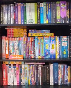 a book shelf filled with lots of children's books