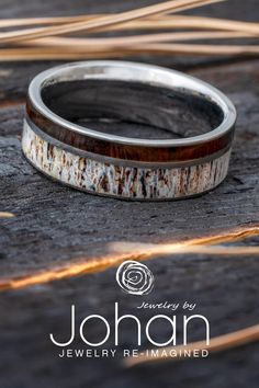 a close up of a wedding ring on a wooden surface