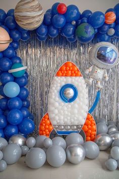 a space themed birthday party with balloons and decorations