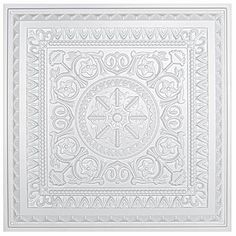 a white square tile with an intricate design on the center and sides, surrounded by decorative elements