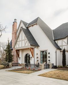 a white house with black trim and windows