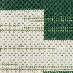 green and white woven fabric close up