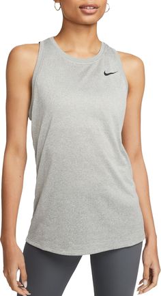 Turn up the heat in the Nike Dri-FIT Tank. Made with sweat-wicking technology to help keep you dry, its sleeveless design and relaxed fit through the body and hips give you a casual look while you power through your workout. Fit & Design: Standard fit: easy and traditional Nike Dri-FIT technology moves sweat away from your skin for quicker evaporation, helping you stay dry and comfortable Fabric feels soft against your skin Nike Gray Athletic Fit Activewear, Breathable Athletic Heather Tops For Sports Season, Casual Sweat-resistant Training Tops, Nike Activewear In Athletic Heather Color, Casual Style, Nike Casual Activewear In Athletic Heather, Nike Casual Activewear In Gray, Breathable Athletic Fit Top In Athletic Heather, Athletic Heather Top For Workout And Sports Season, Athletic Heather Breathable Top With Athletic Fit