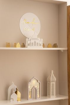 the shelves are decorated with paper cutouts and gold lettering that says, rama adhan