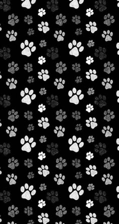 an animal print with white and gray paw prints on a black background for wallpaper