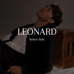 a man laying on top of a bed next to a wooden box with the words leonard above it