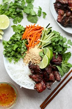 vietnamese noodle bowl with grilled pork, carrots and cilantro sauce