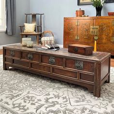 a living room with a large wooden coffee table in it's centerpieces