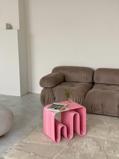 a living room with two couches and a coffee table in the middle of it