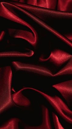 red silk fabric textured up close to the camera