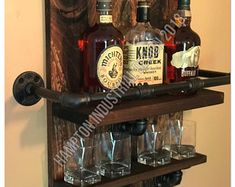 a wooden shelf with bottles and glasses on it