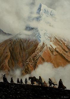 a group of people riding horses on top of a mountain