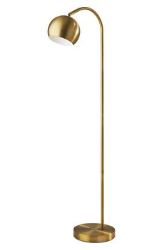 a brass colored floor lamp with a white light on the base and a round shade