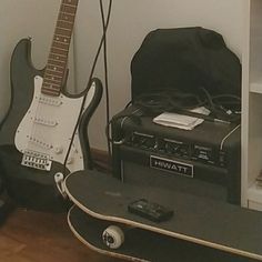 an electric guitar and amp are sitting next to each other