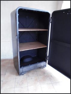 an open metal storage cabinet with shelves inside