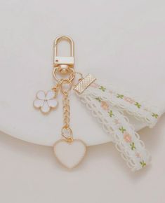 a key chain with a heart charm attached to it