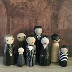 a group of wooden dolls standing next to each other