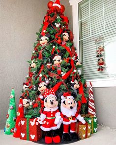 a christmas tree with mickey and minnie mouse decorations