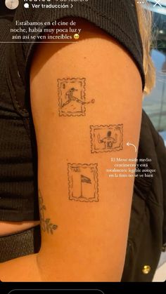 the back of a woman's arm with tattoos on her left shoulder and an image of