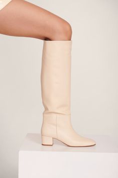 The Nancy is the epitome of the classic 60s knee high boot. The wider shaft and the slightly-square-but-round toe shape to give a vintage rainboot silhouette. Super comfy and cool for all occasions. Cream Knee High Boots, Boot Fits, Heel Accessories, Mule Sandals, Goat Leather, Flat Boots, Denim Flares, Sneaker Heels, Fashion Books