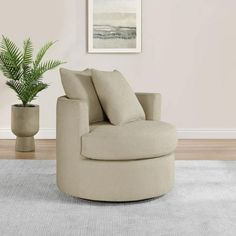 a living room with a chair and potted plant