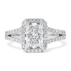 This lab-grown diamond ring is all glamour with a split shank halo design reminiscent of the Art Deco era. Crafted in bright 14-karat white gold  this diamond-encrusted design frames a beautiful radiant cut center stone. Wedding Rings Sets His And Hers, Radiant Cut Diamond Ring, Rings Sets, Ring Cuts, Ring Inspiration, Engagement Ring Inspiration, Split Shank Ring, Halo Design, Diamond Halo Ring