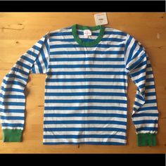 Really Cute Nwt Hanna Andersson Striped Top. Size S Unisex (Equivalent To Women’s Medium), Turquoise And White Stripes With Green Trim (Last Pic Of Sleeve Detail Shows Closest To Actual Color. Pics Showing It Flat On Table Seem A Bit Darker.). 17 1/2” Across At Bust Lying Flat (See Last Pic) Blue Relaxed Fit Tops With Contrast Stripes, Relaxed Fit Blue Tops With Contrast Stripes, Spring Blue Tops With Contrast Stripes, Epic Clothes, Fall Winter Trends, She Is Clothed, Red And Teal, Striped Long Sleeve Shirt, Winter Trends