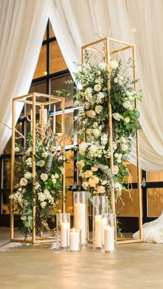 candles and flowers are arranged on the floor